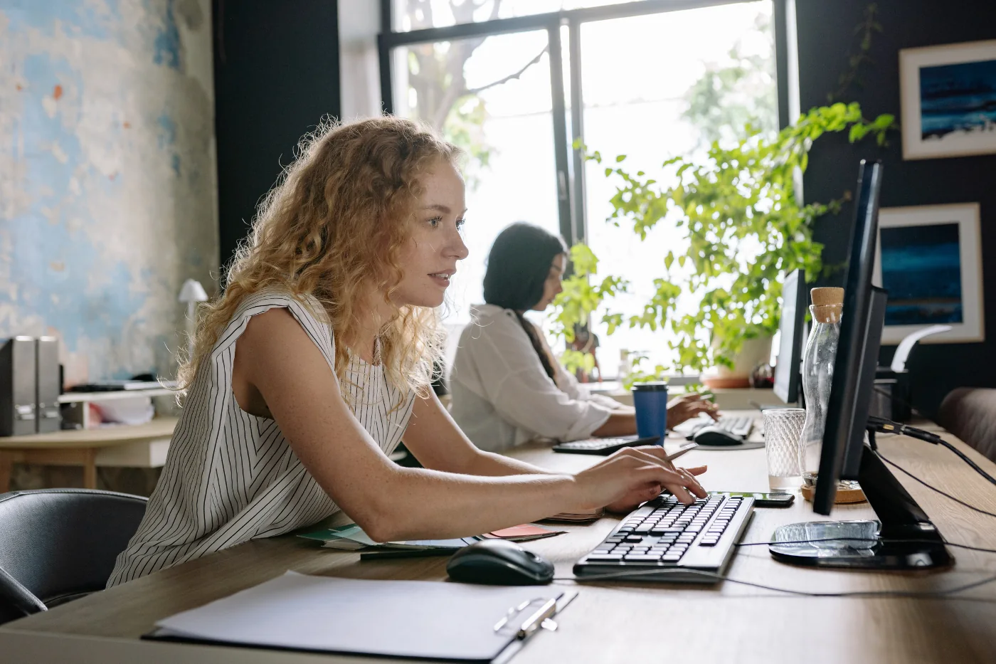 Woman working at computer in modern office